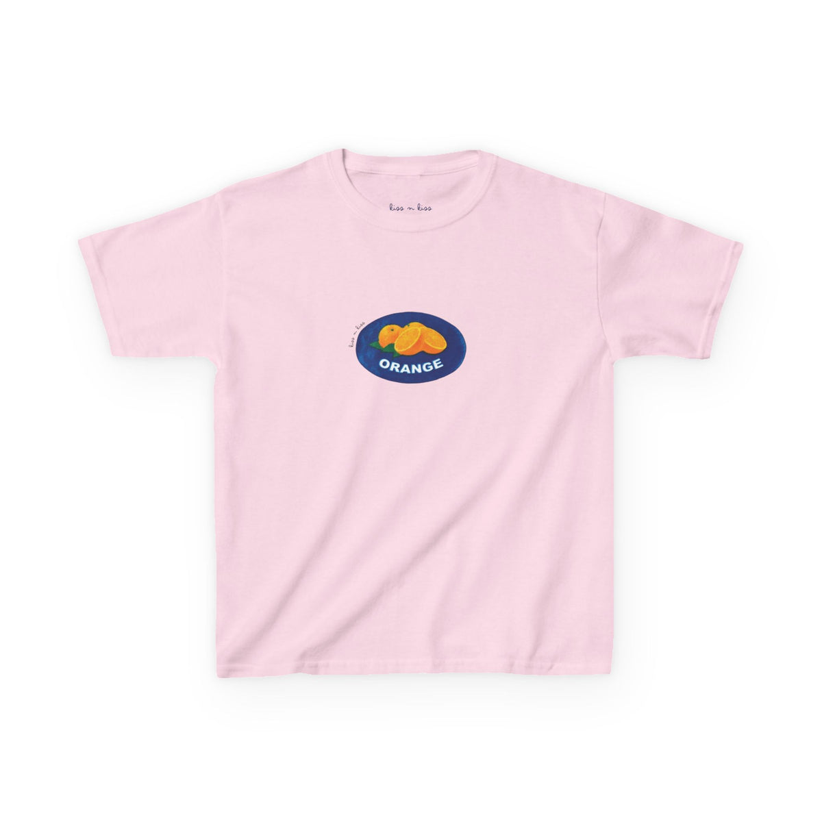 A light pink t-shirt featuring a retro fruit market produce sticker graphic with bright oranges inside a blue oval.