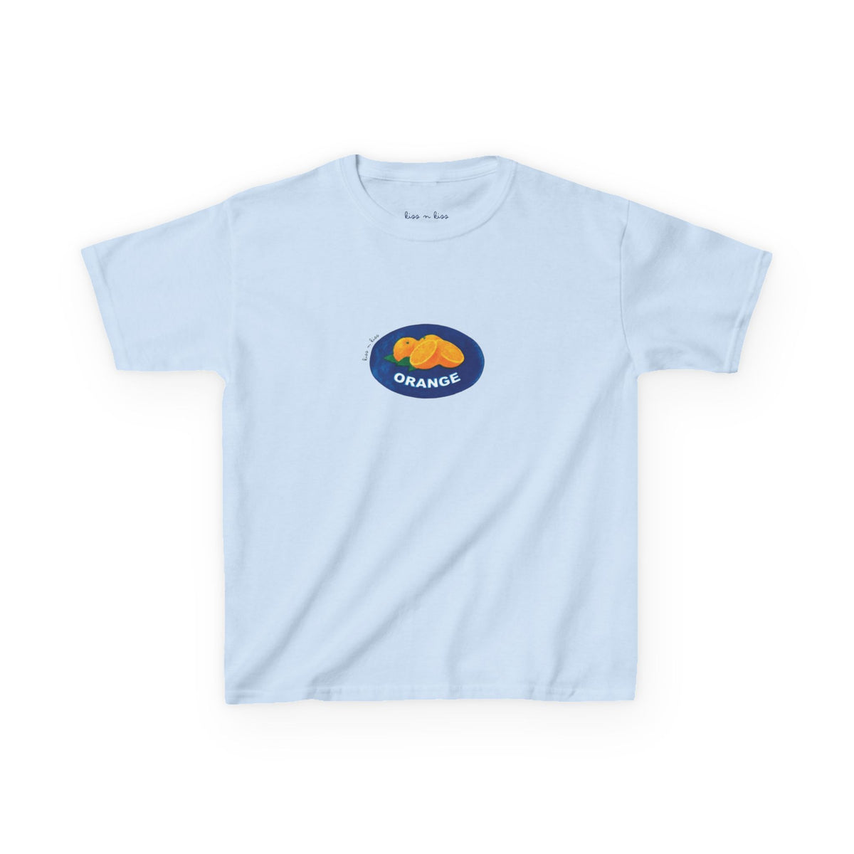 A light blue t-shirt featuring a retro fruit market produce sticker graphic with bright oranges inside a blue oval.